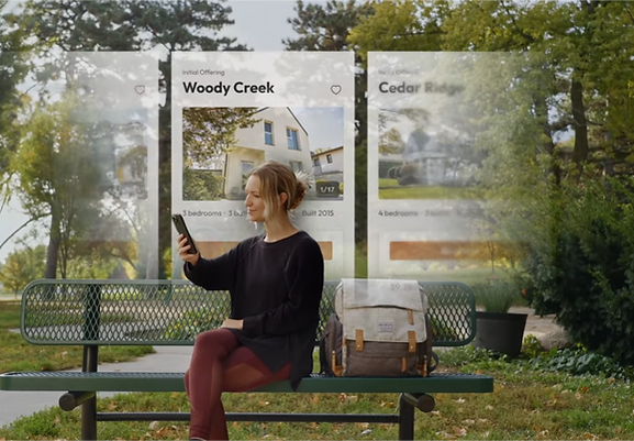 Woman sitting on a park bench browsing investment property opportunities