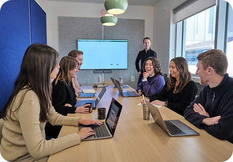 Neuron UX Team meeting at a conference table